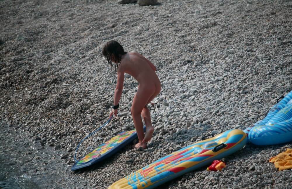 Naturist Surf Board Glides pics - Nudism strengthens health and self-esteem